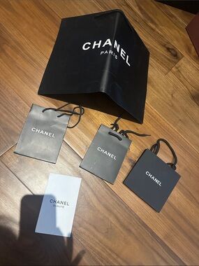 CHANEL Black medium and Mini Shopping Bags with Chanel Beauté Card envelope.